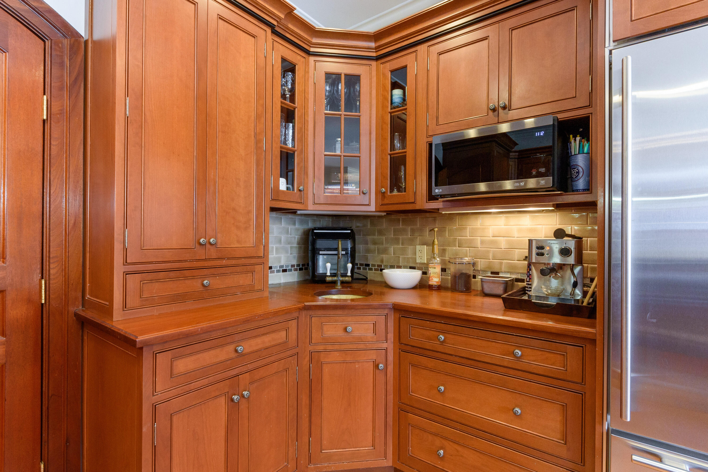 10 Mayflower Road Darien, CT 06820 - Photo 13 of 38 a kitchen with granite countertop cabinets stainless steel appliances and potted plant