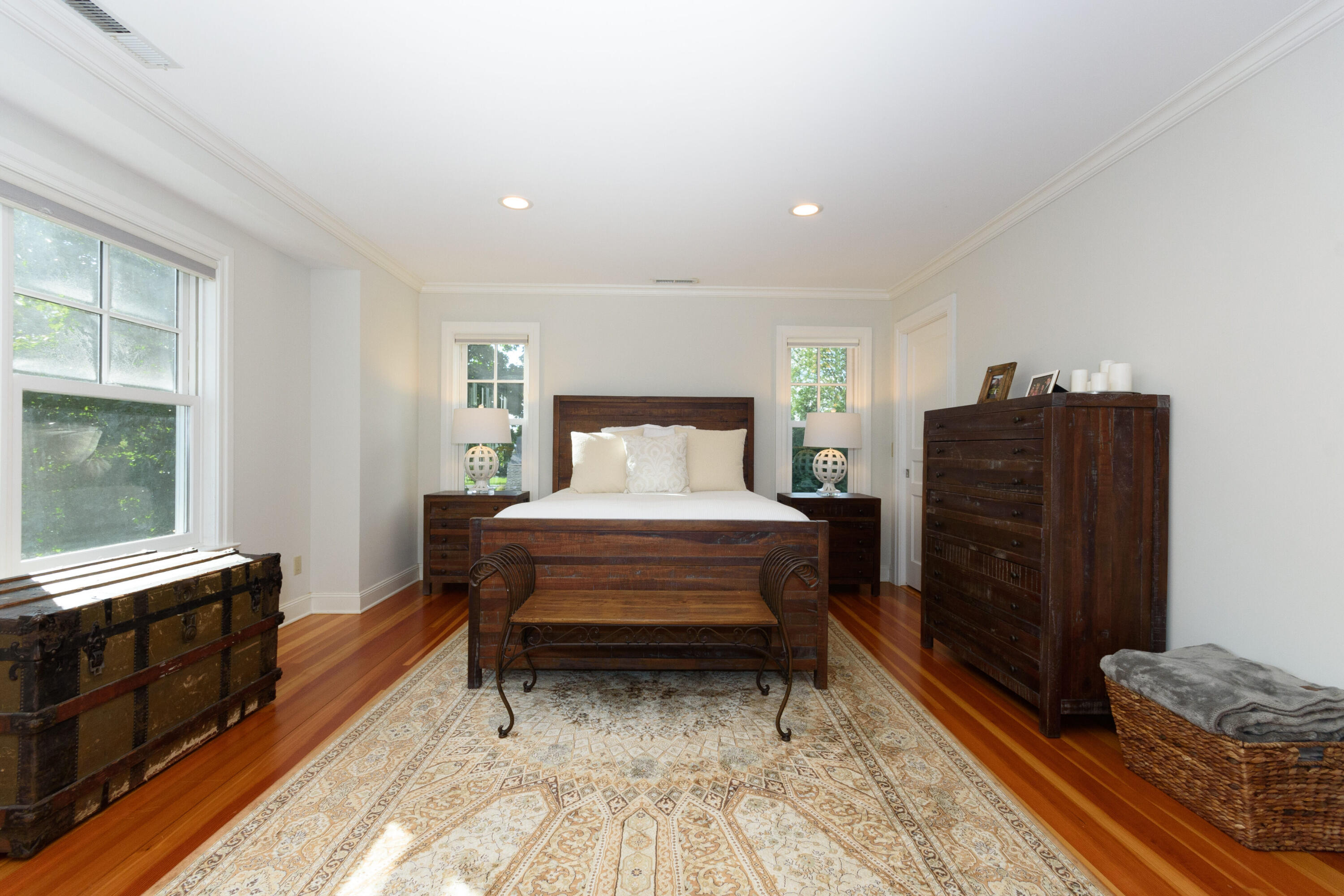 10 Mayflower Road Darien, CT 06820 - Photo 16 of 38 a bedroom with a bed and furniture