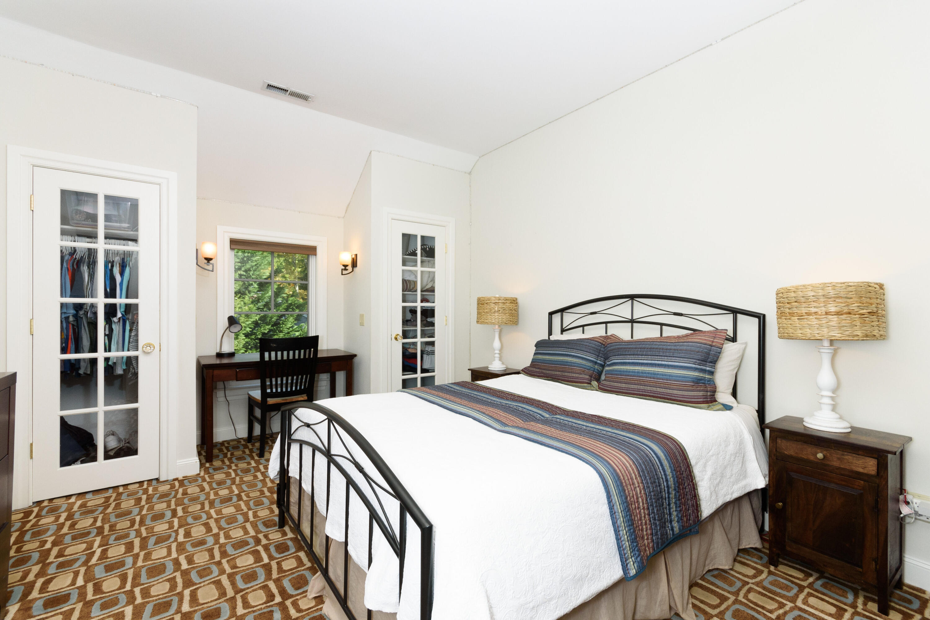 10 Mayflower Road Darien, CT 06820 - Photo 20 of 38 a bedroom with a bed and wooden floor