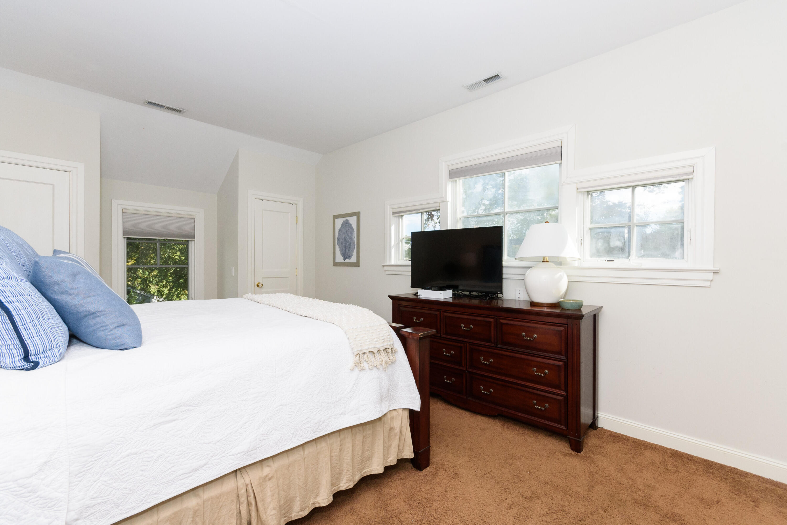 10 Mayflower Road Darien, CT 06820 - Photo 23 of 38 a bedroom with a bed and a flat screen tv