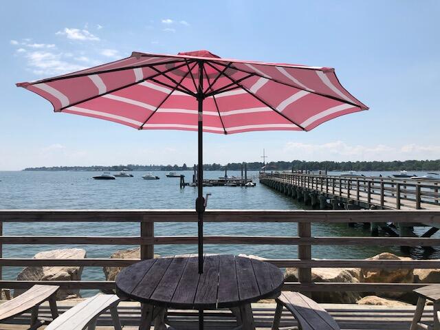 10 Mayflower Road Darien, CT 06820 - Photo 33 of 38 a table tennis table and chairs under an umbrella