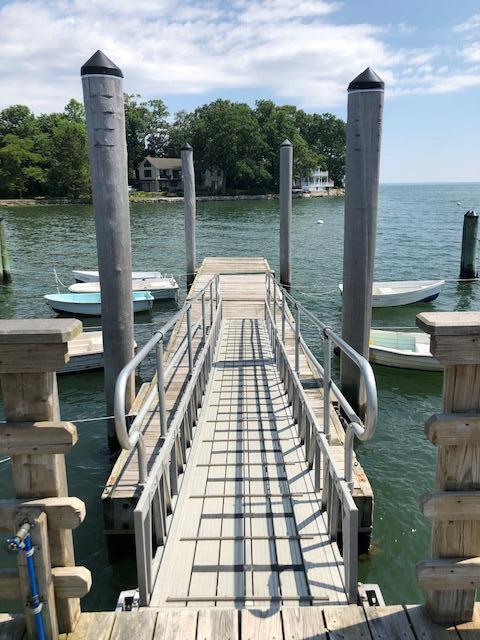 10 Mayflower Road Darien, CT 06820 - Photo 35 of 38 a view of a lake with a table and chairs