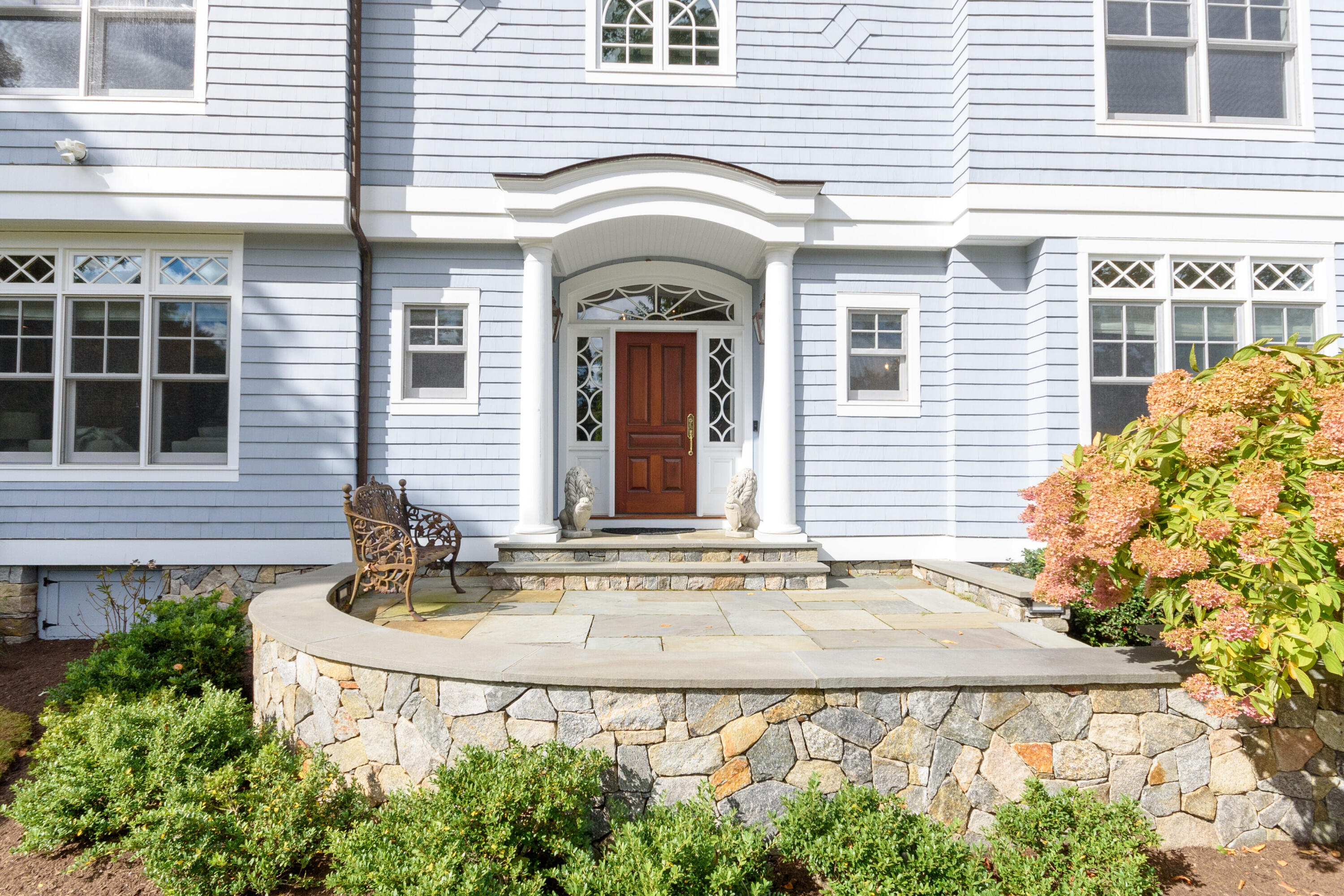 10 Mayflower Road Darien, CT 06820 - Photo 5 of 38 a front view of a house with plants