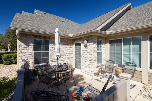 a view of backyard with outdoor seating