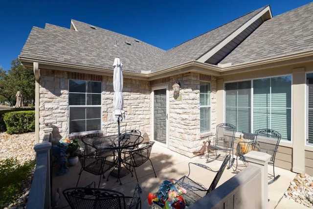 a view of backyard with outdoor seating