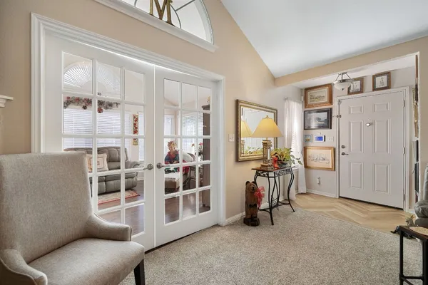 a view of a livingroom with furniture and windows