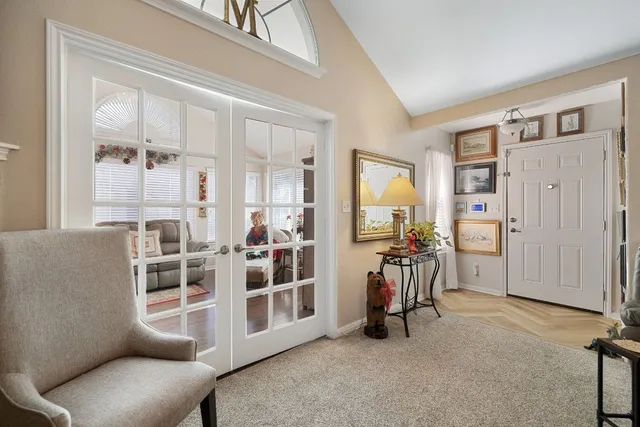 a view of a livingroom with furniture and windows