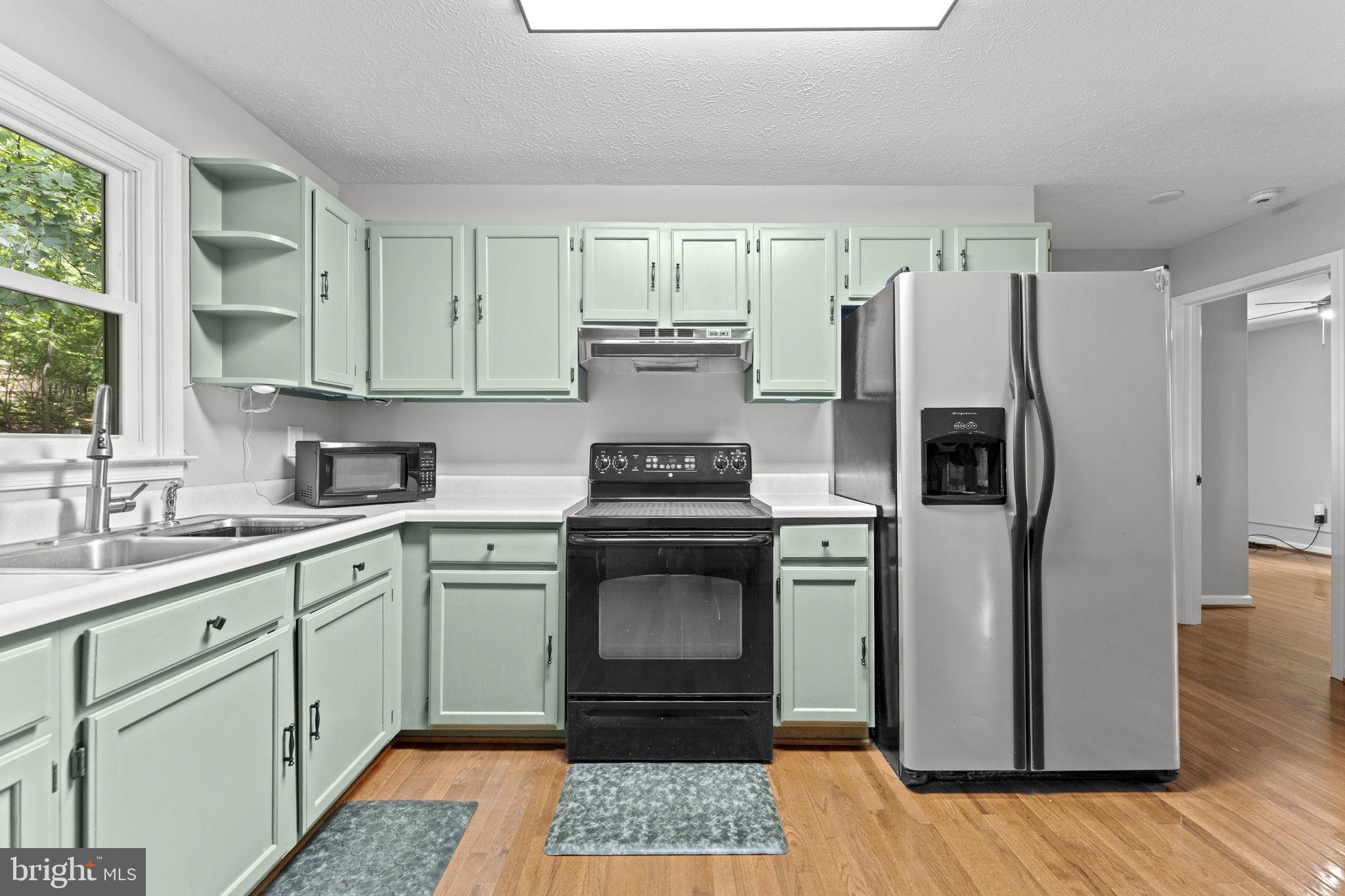 111 Geronimo Trail Winchester, VA 22602 - Photo 11 of 43 Fun mint green cabinetry