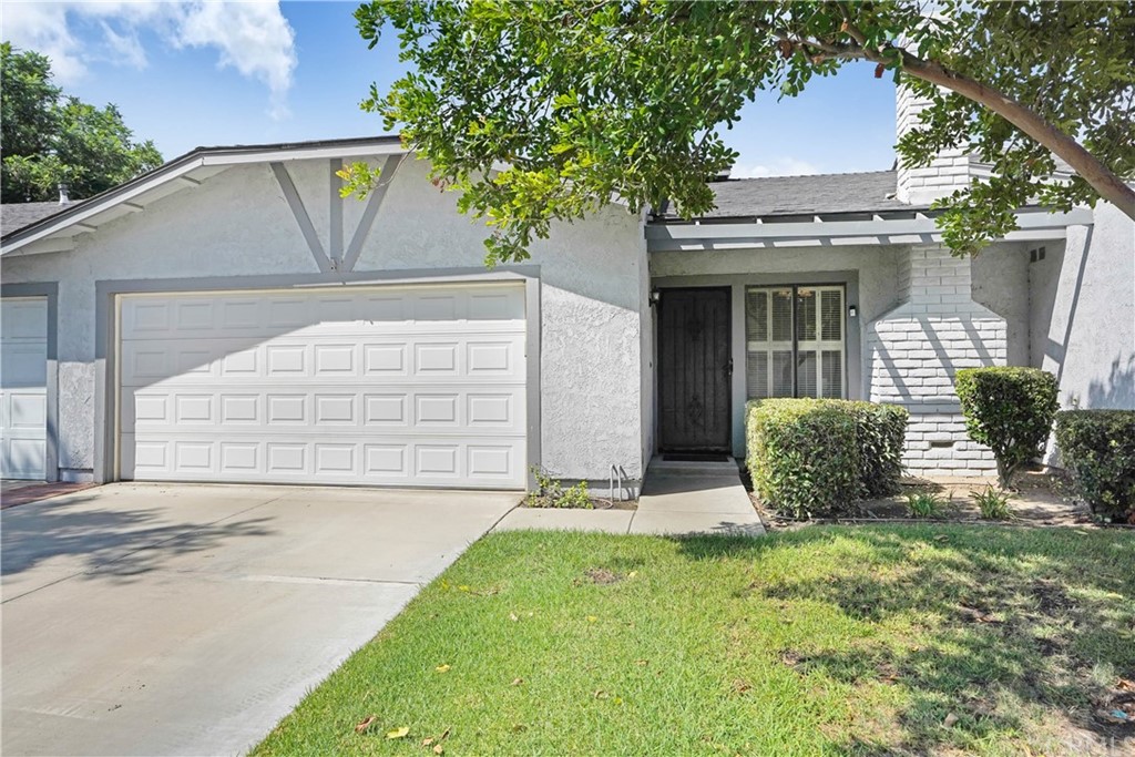 9017 Chaucer Circle Riverside, CA 92503 - Photo 1 of 1 a front view of a house with garden