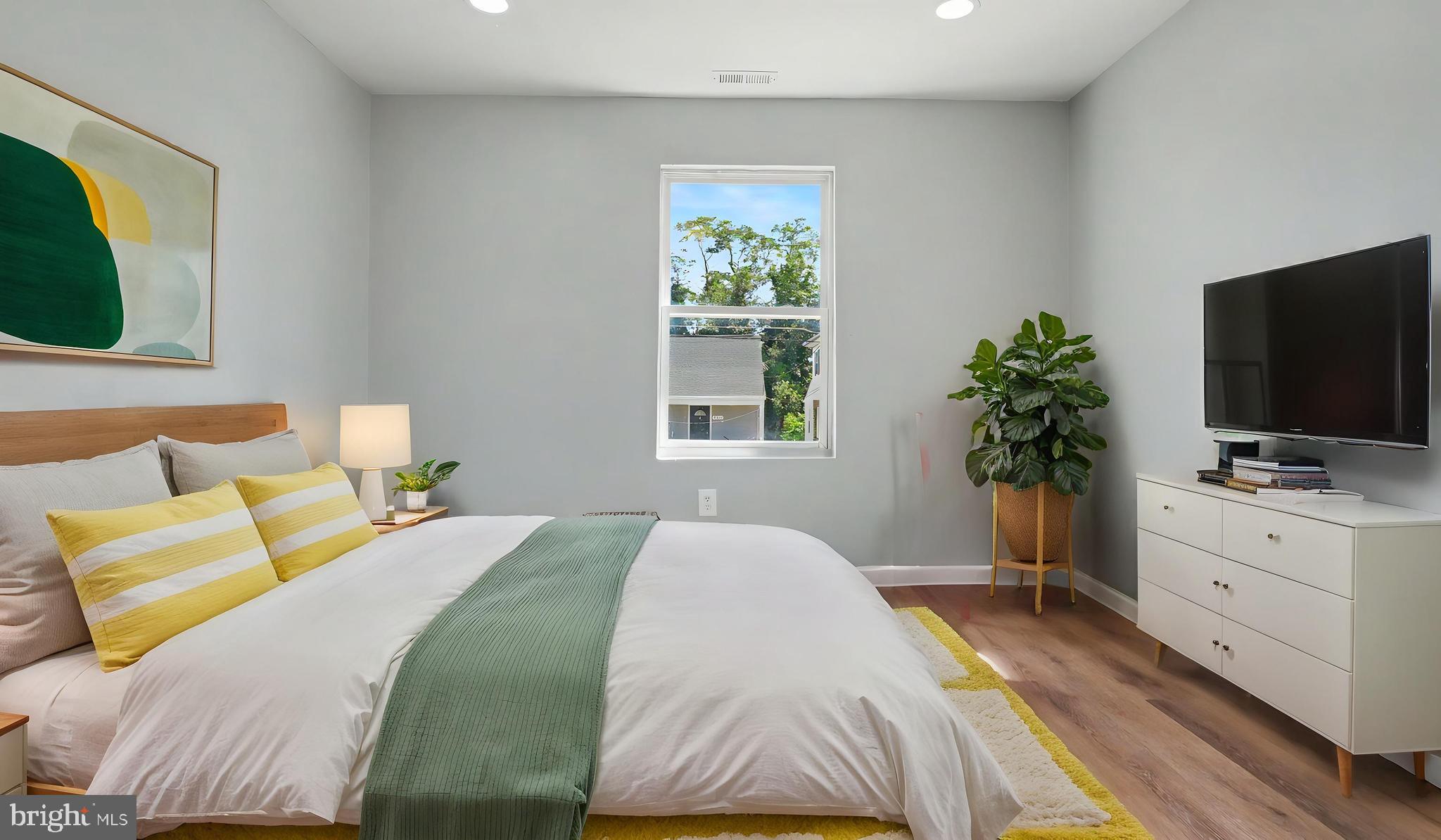 4203 Shell Street Capitol Heights, MD 20743 - Photo 18 of 47 a bedroom with a bed and a flat screen tv