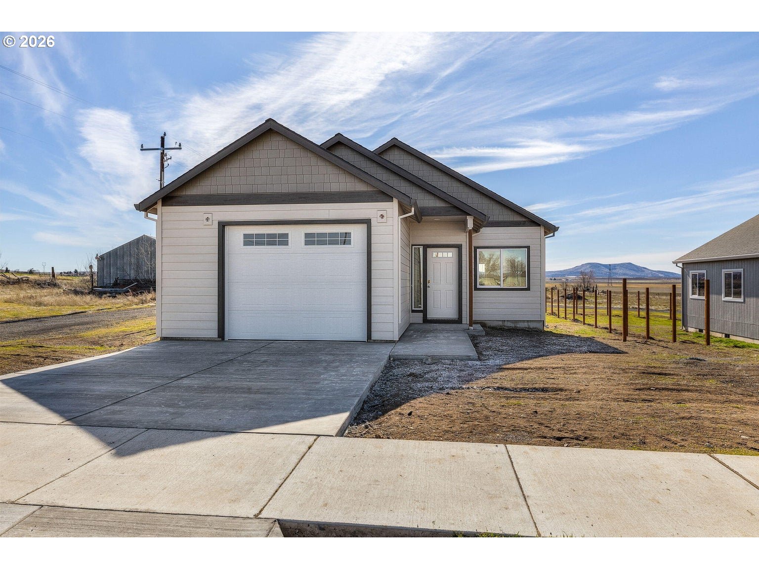 518 Southwest 6th Street Madras, OR 97741 - Photo 3 of 19 a view of a house with a yard