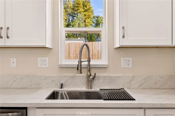 a kitchen with a sink and cabinets