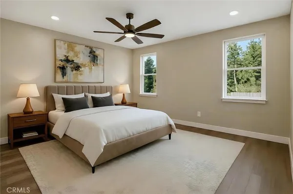 a bedroom with a large bed and a window