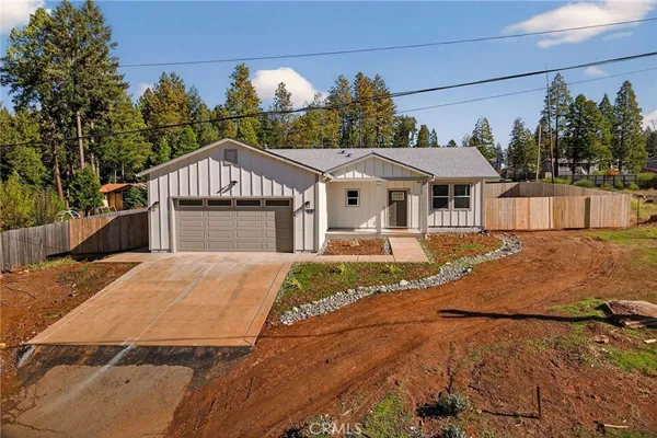 a house with trees in the background