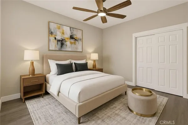 a bedroom with a bed and lamp
