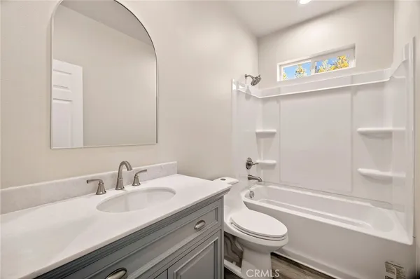 a bathroom with a sink a toilet and a bathtub
