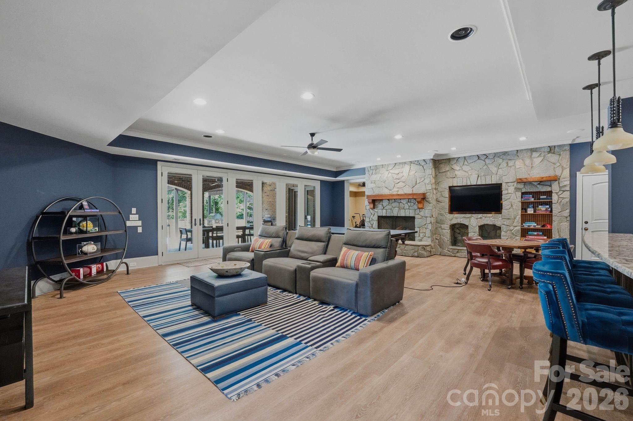7416 Lee Rea Road Charlotte, NC 28226 - Photo 36 of 48 a living room with furniture and a flat screen tv