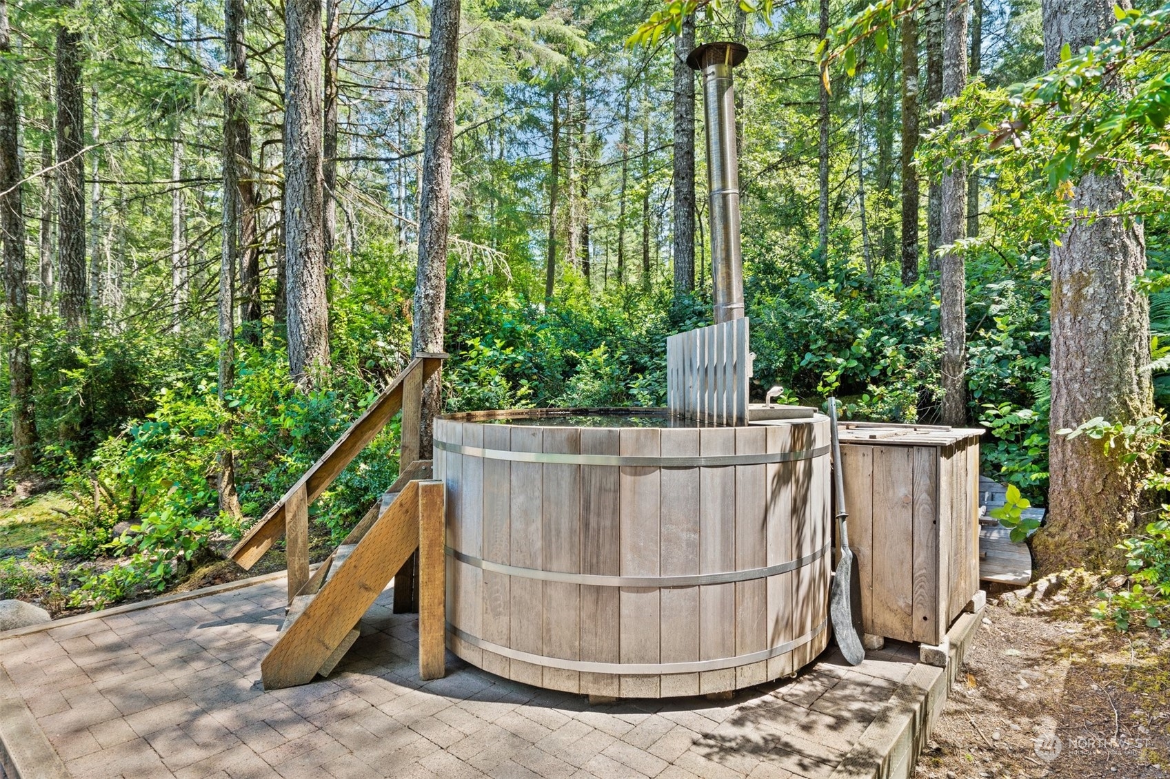 1500 Northeast Bear Ridge Road Belfair, WA 98528 - Photo 21 of 40 a view of outdoor space with swimming pool and trees in the background
