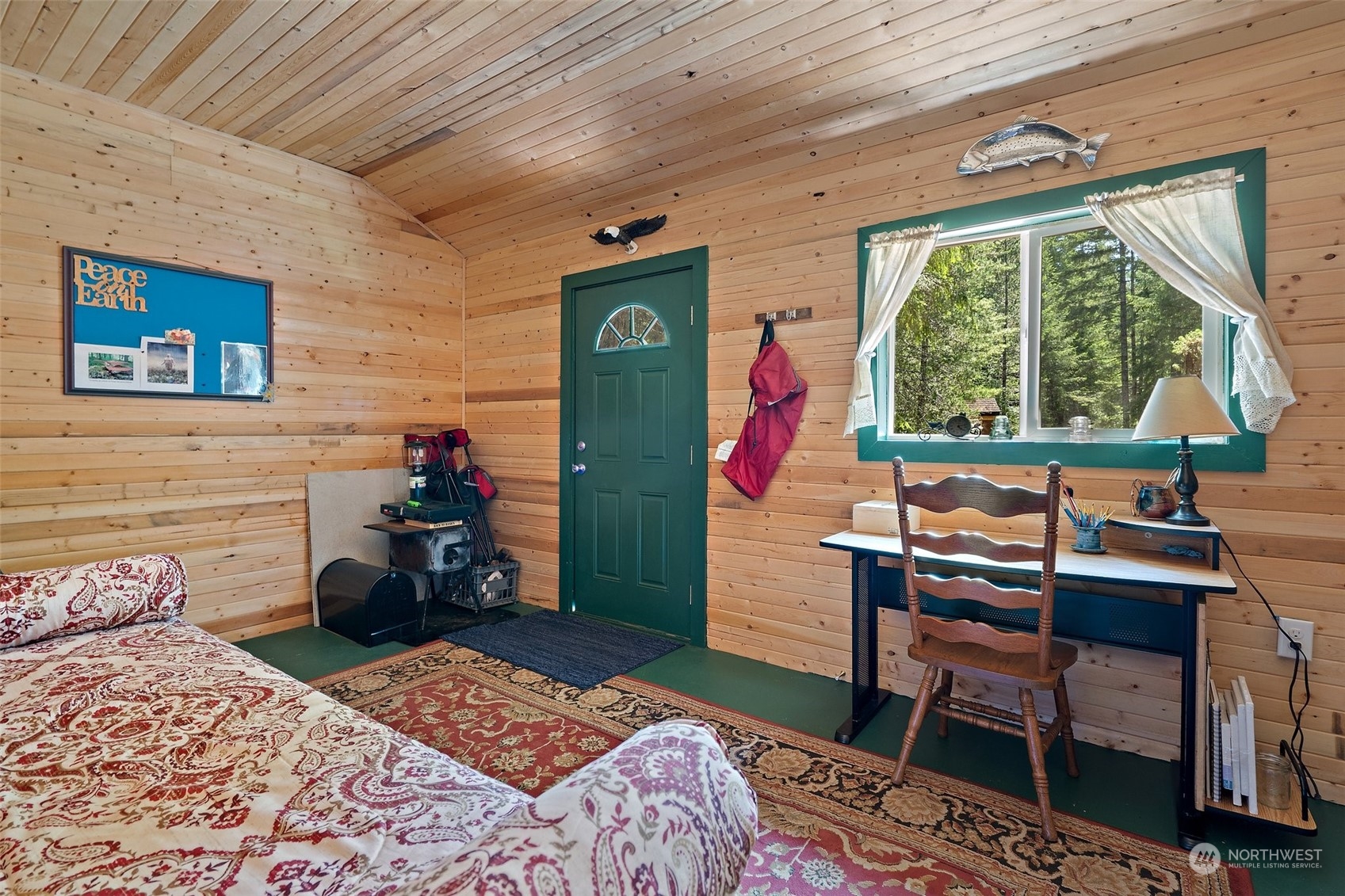 1500 Northeast Bear Ridge Road Belfair, WA 98528 - Photo 30 of 40 a bedroom with a bed and a table