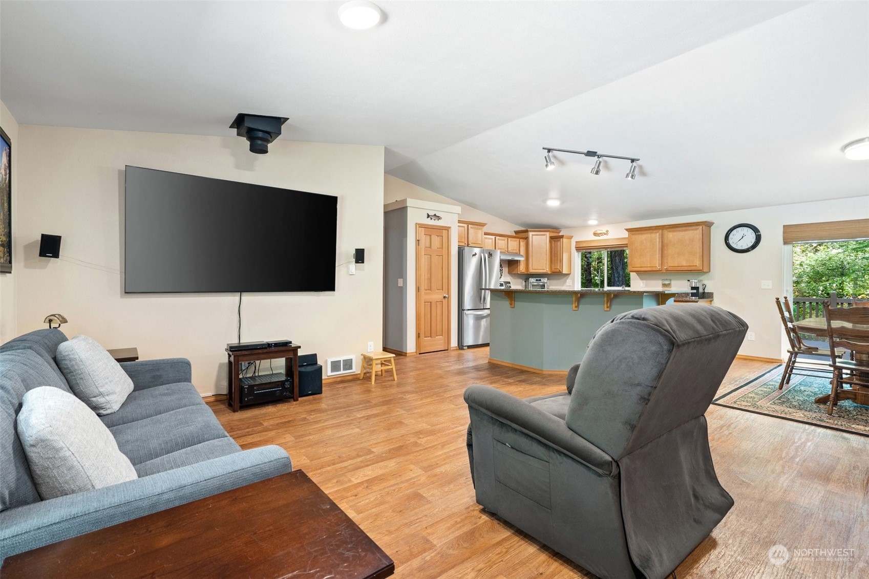 1500 Northeast Bear Ridge Road Belfair, WA 98528 - Photo 3 of 40 a living room with furniture and a flat screen tv