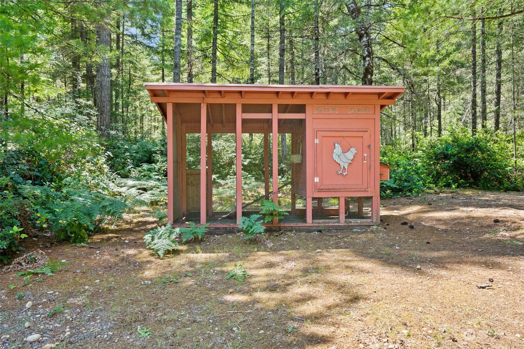 1500 Northeast Bear Ridge Road Belfair, WA 98528 - Photo 33 of 40 a view of a house with a yard and sitting area