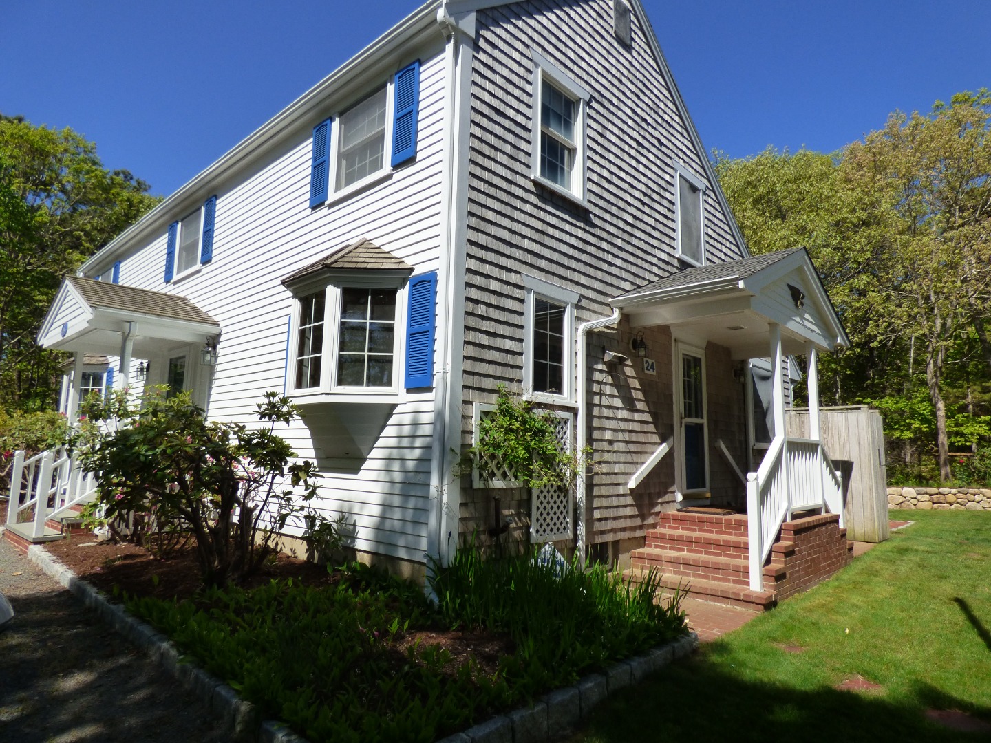 24 Mariners Way Edgartown, MA 02539 - Photo 46 of 50 a view of house with a yard and potted plants