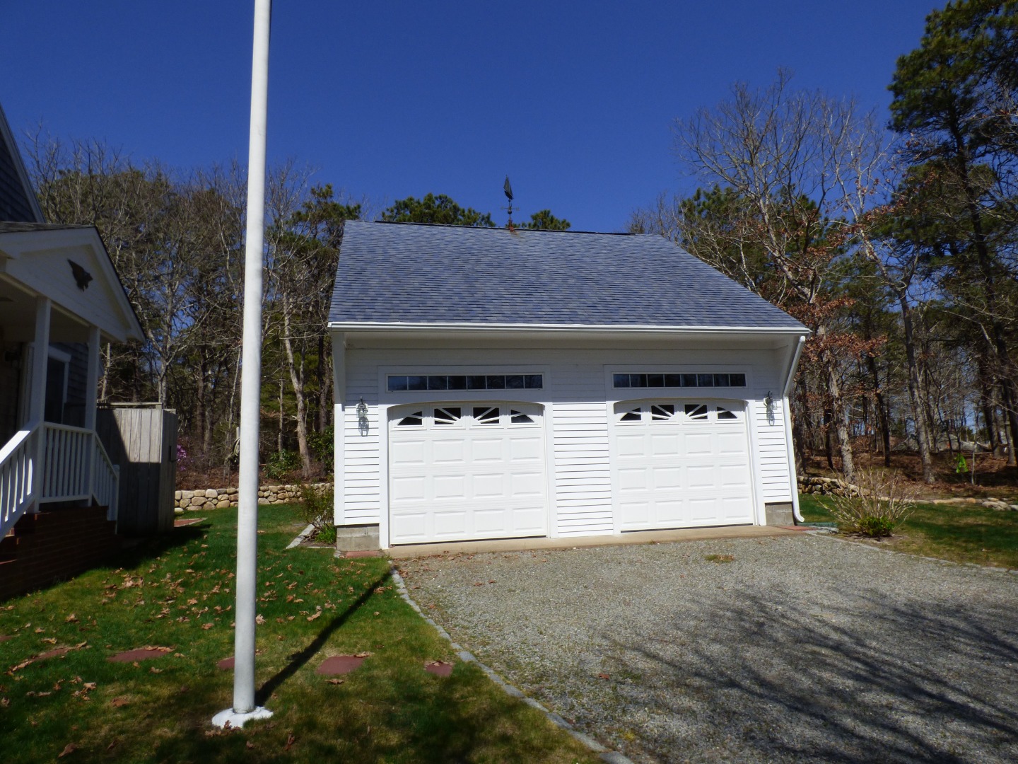 24 Mariners Way Edgartown, MA 02539 - Photo 5 of 50 a front view of a house with a yard