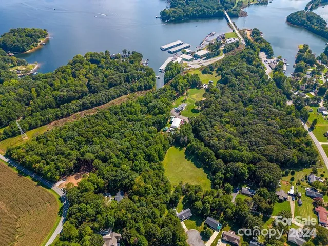 an aerial view of residential house with outdoor space and lake view
