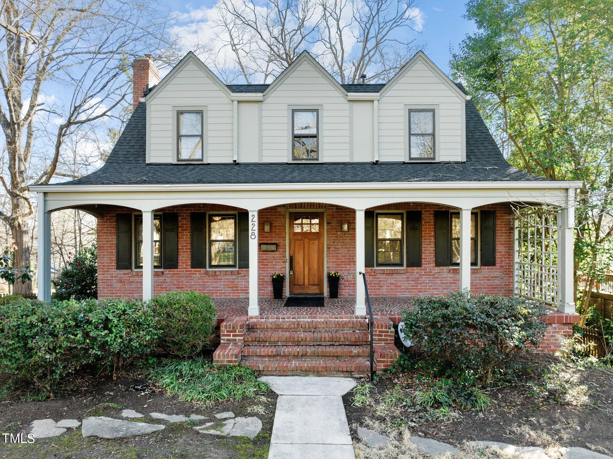 228 Furches Street Raleigh, NC 27607 - Photo 1 of 65 a front view of a house with garden