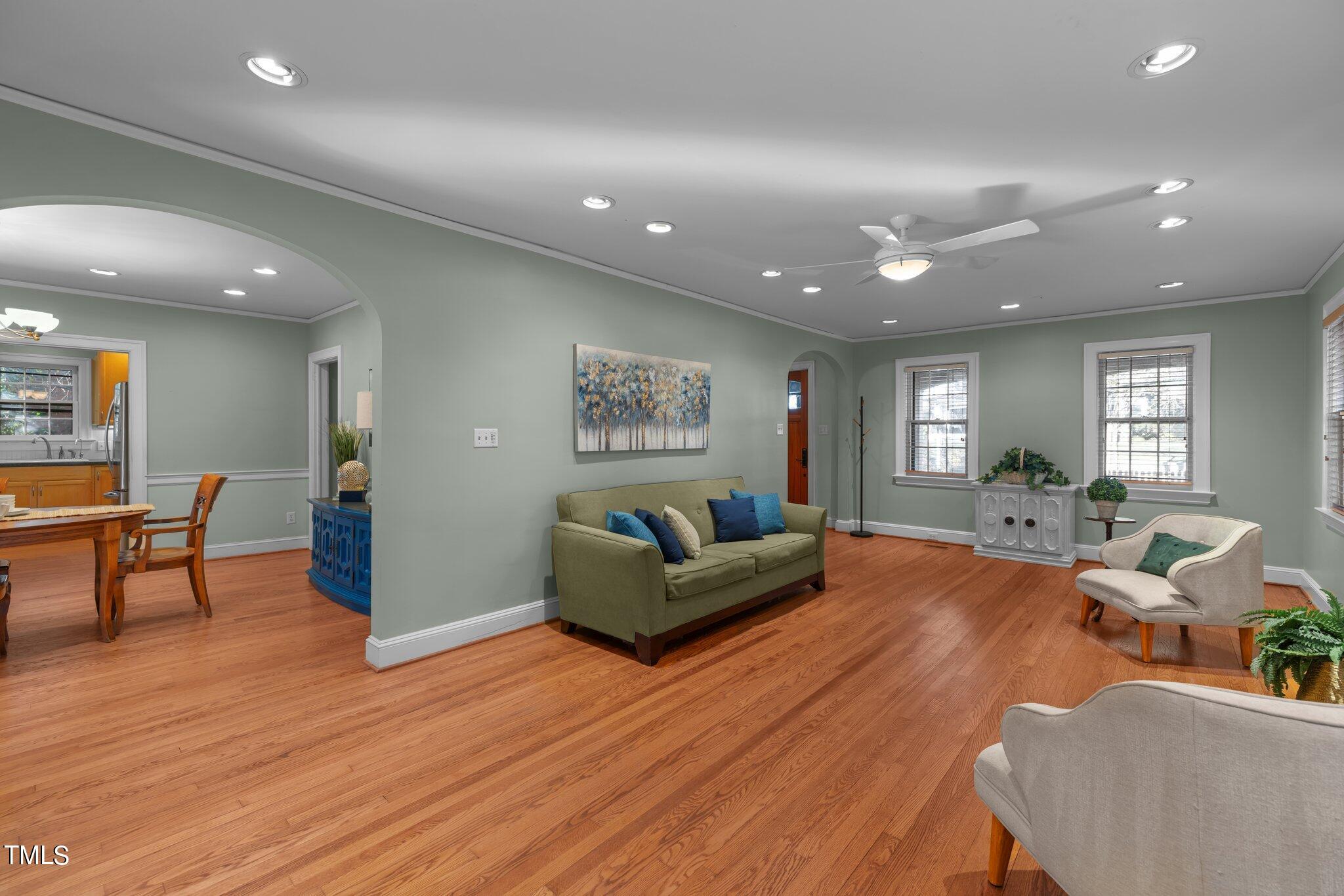 228 Furches Street Raleigh, NC 27607 - Photo 11 of 65 a living room with furniture and a wooden floor