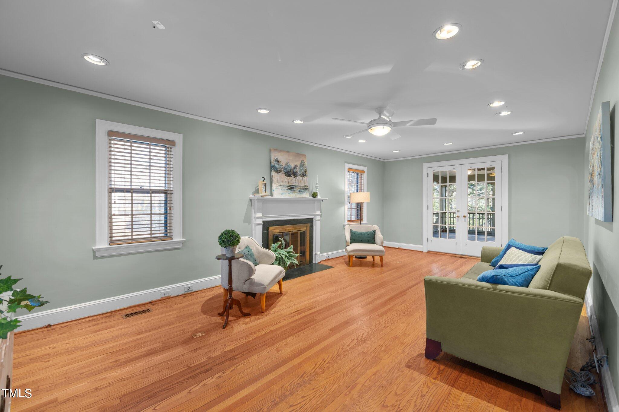 228 Furches Street Raleigh, NC 27607 - Photo 12 of 65 a living room with furniture and a fireplace