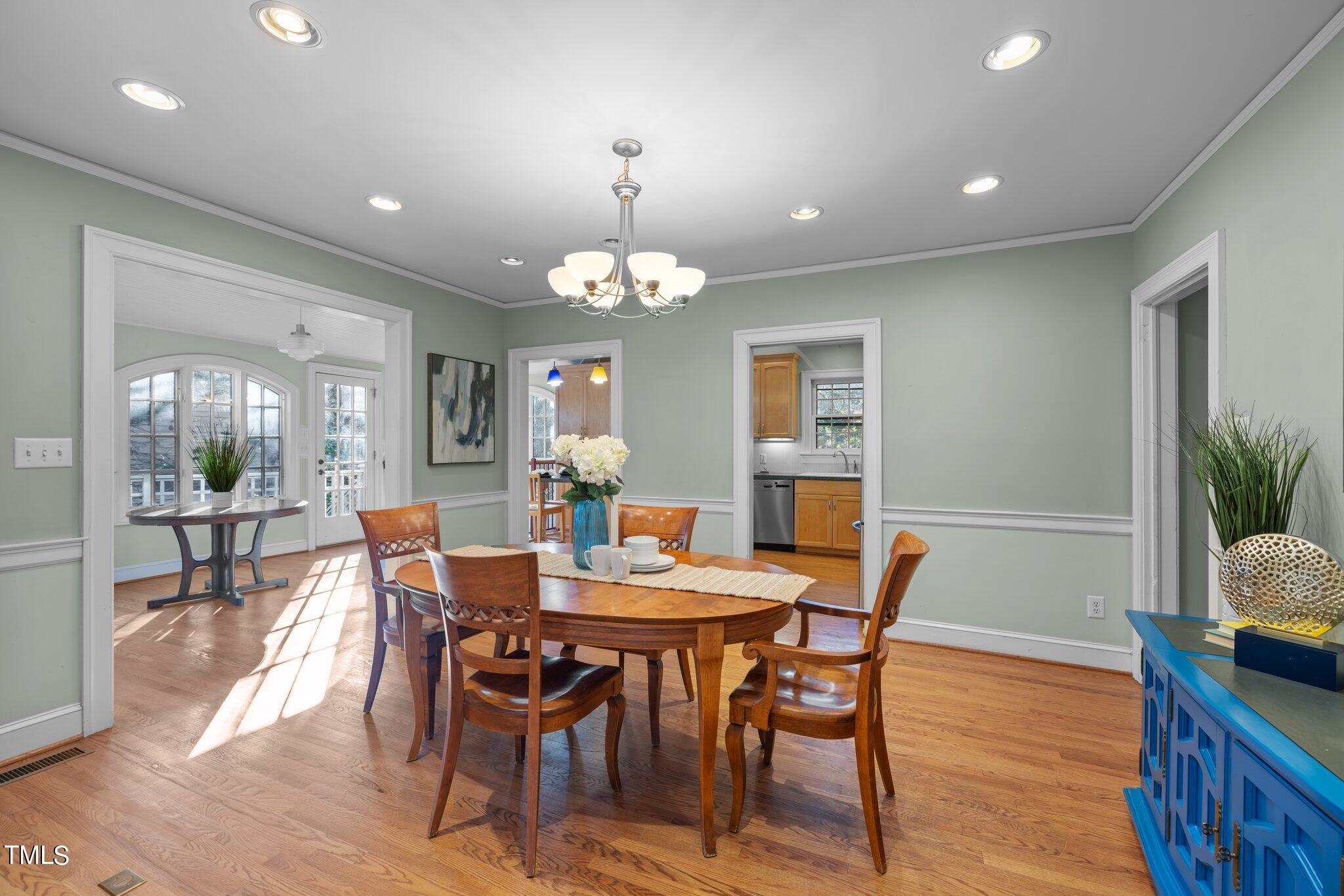 228 Furches Street Raleigh, NC 27607 - Photo 17 of 65 a view of a dining room with furniture and wooden floor