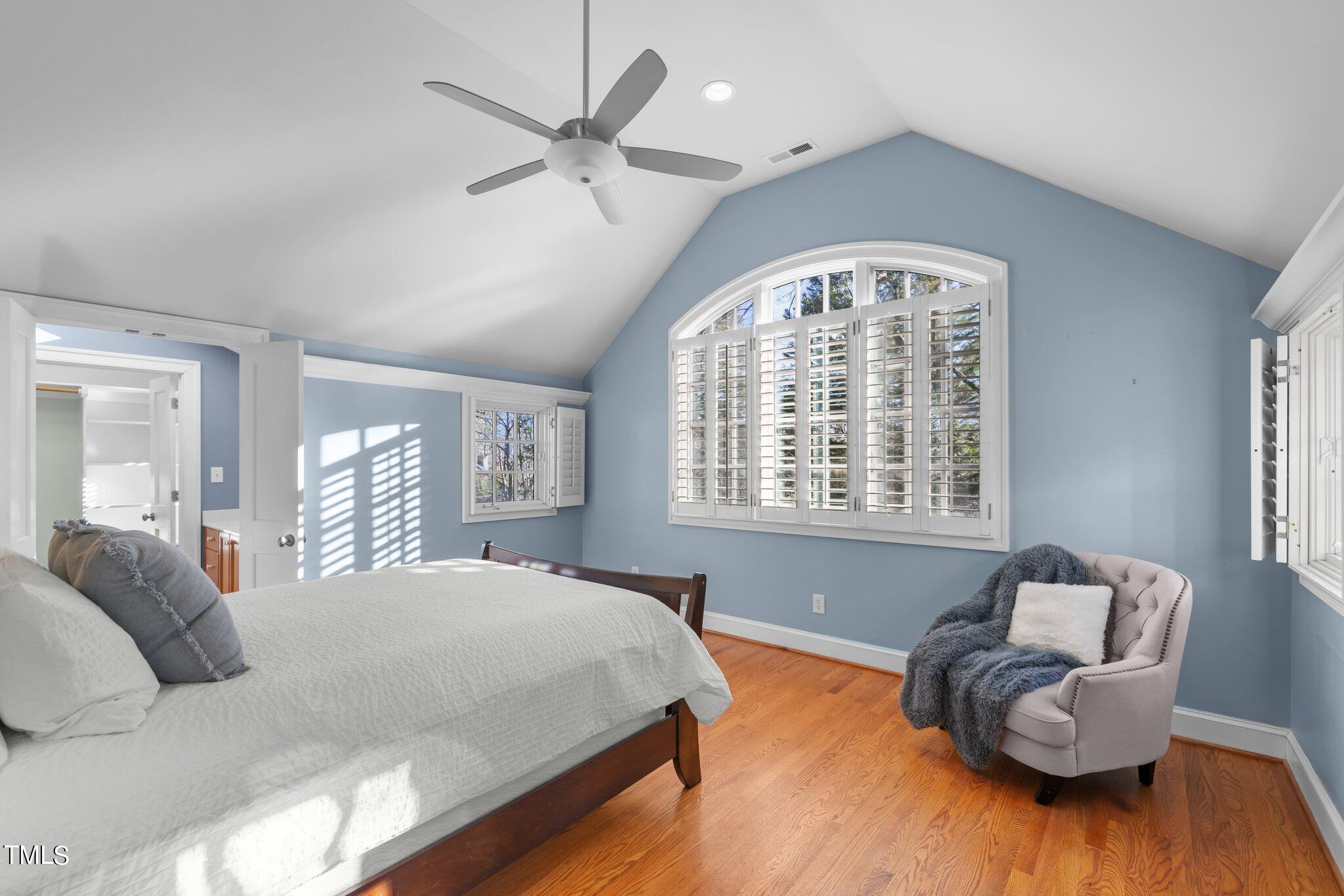 228 Furches Street Raleigh, NC 27607 - Photo 30 of 65 a spacious bedroom with a bed and a large window