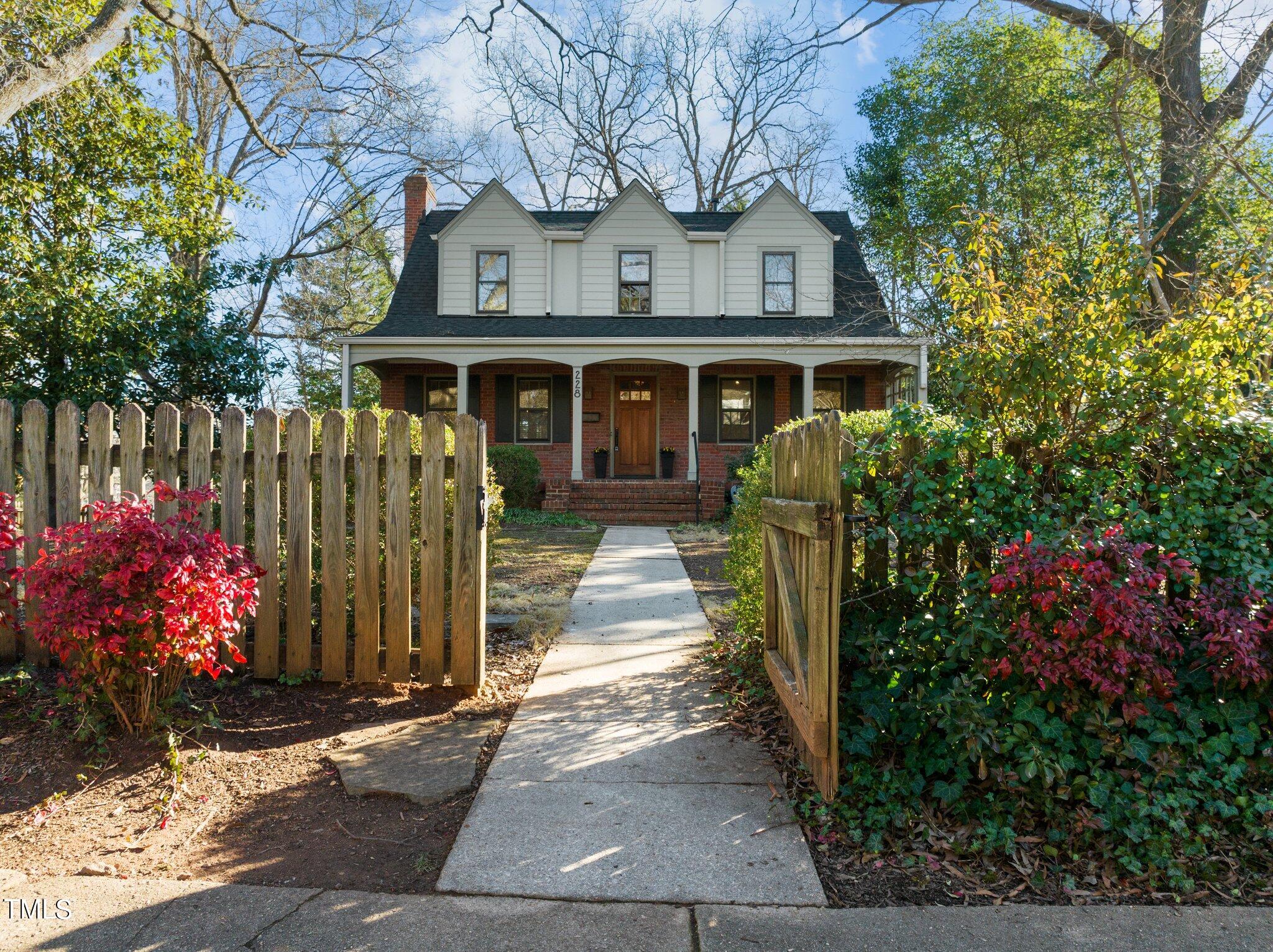 228 Furches Street Raleigh, NC 27607 - Photo 3 of 65 a front view of a house with a garden