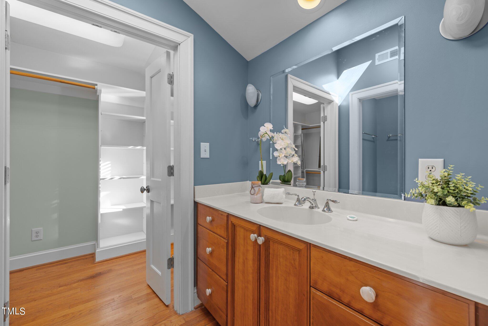228 Furches Street Raleigh, NC 27607 - Photo 31 of 65 a bathroom with a sink and a mirror