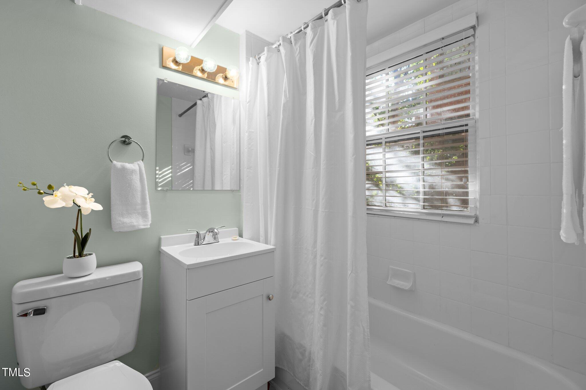 228 Furches Street Raleigh, NC 27607 - Photo 42 of 65 a bathroom with a sink toilet and shower
