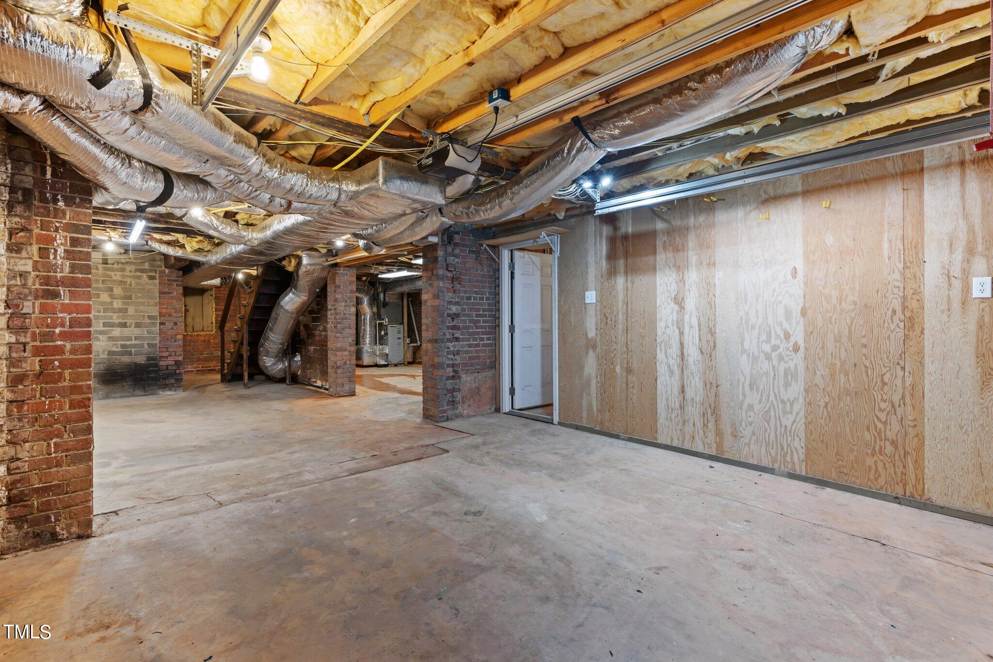 228 Furches Street Raleigh, NC 27607 - Photo 45 of 65 a view of empty room with wooden walls