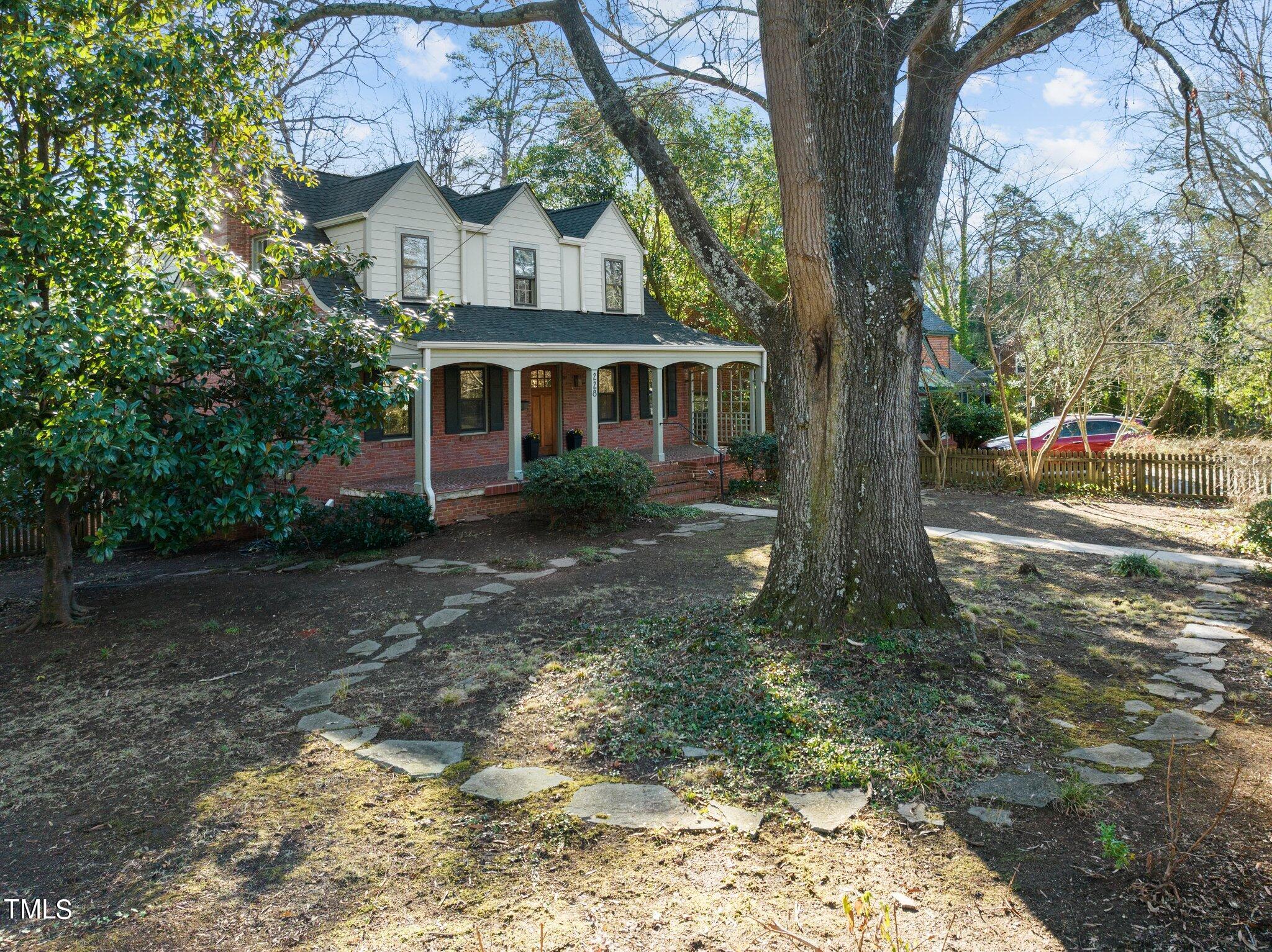 228 Furches Street Raleigh, NC 27607 - Photo 55 of 65 a front view of a house with garden