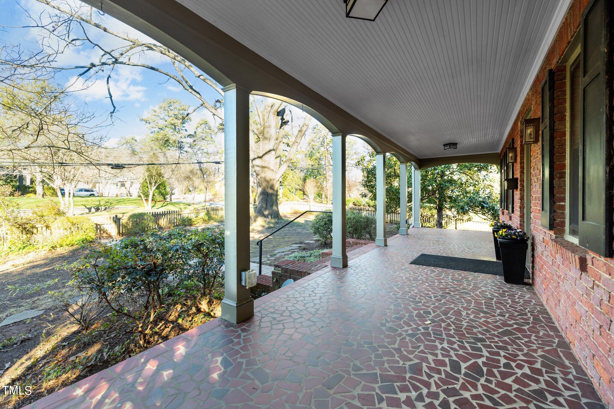 228 Furches Street Raleigh, NC 27607 - Photo 58 of 65 a view of a porch with wooden floor and outdoor space