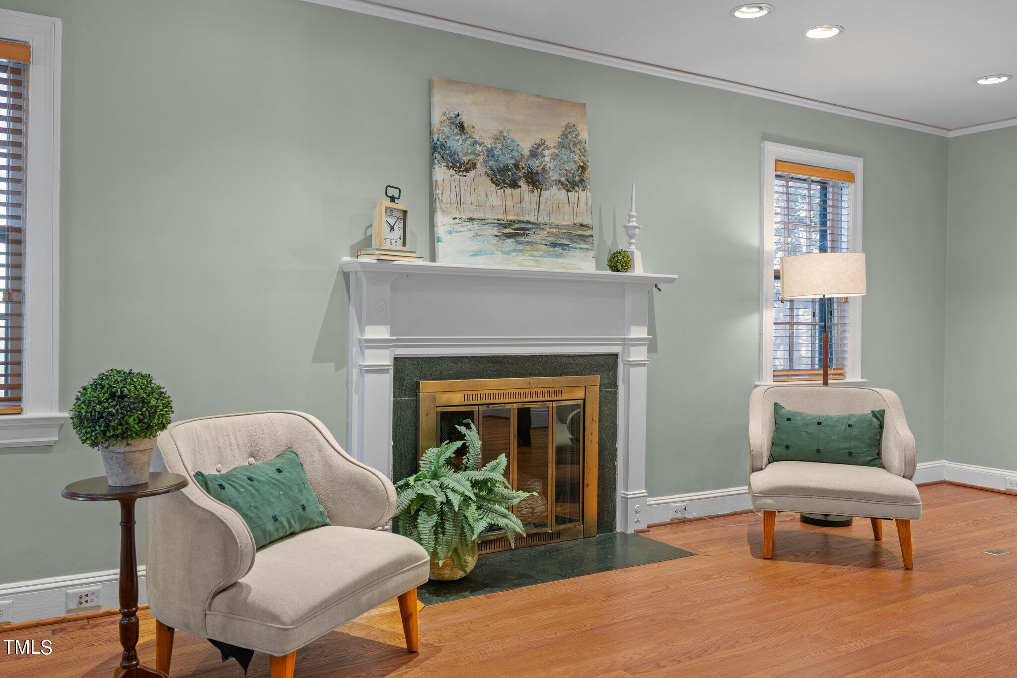 228 Furches Street Raleigh, NC 27607 - Photo 8 of 65 a living room with furniture and a fireplace