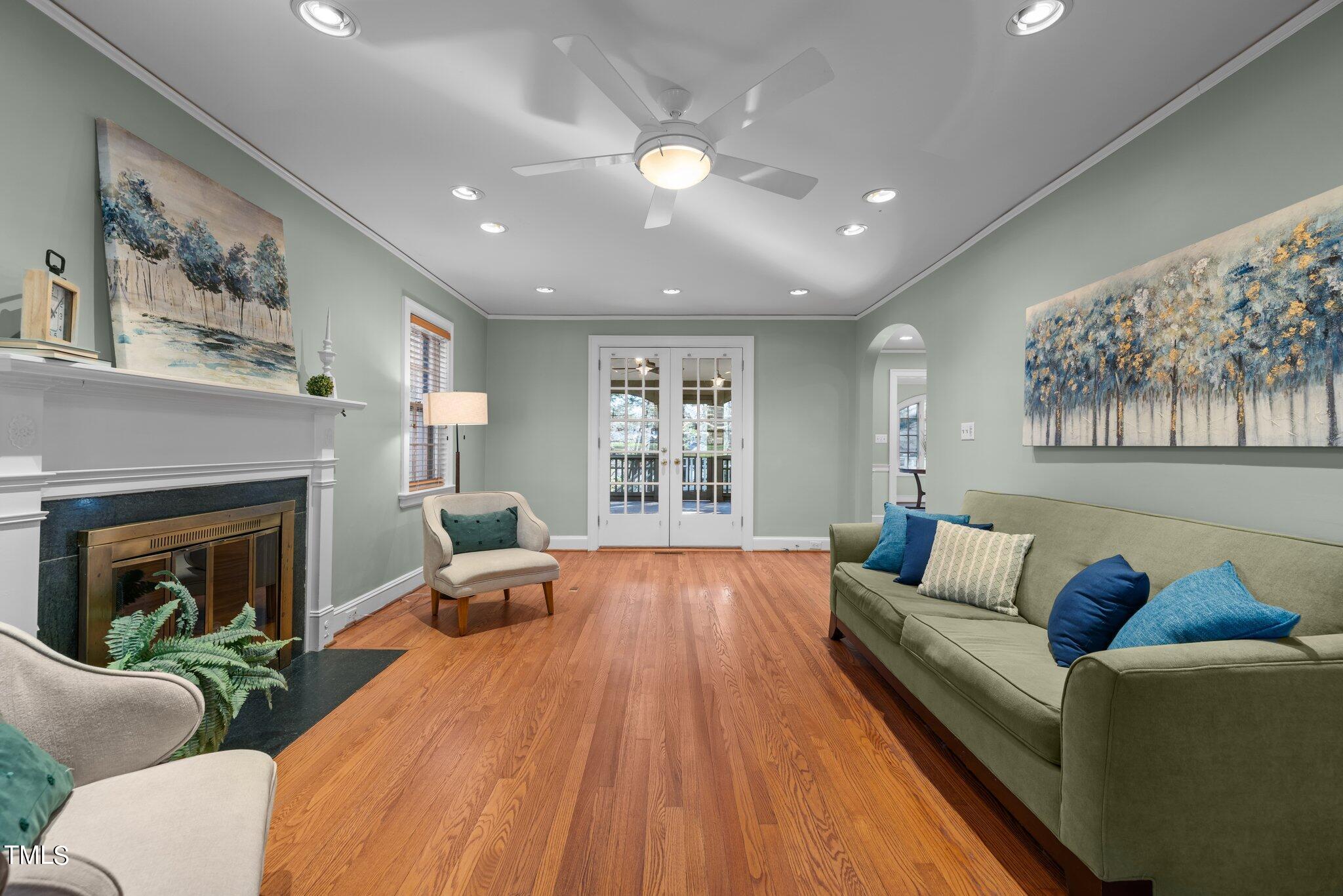 228 Furches Street Raleigh, NC 27607 - Photo 9 of 65 a living room with furniture and a fireplace
