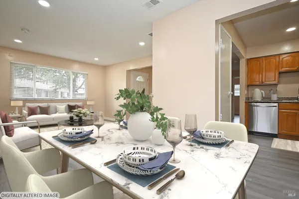 a living room with furniture and a table