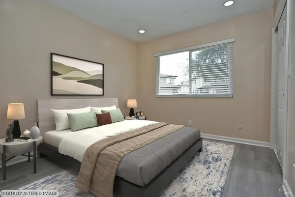 a bedroom with bed and a window