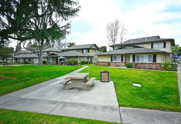 a view of house with swimming pool and porch