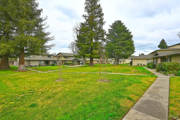 a view of a house with a big yard
