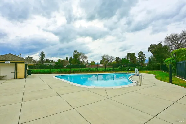 a view of swimming pool with a patio