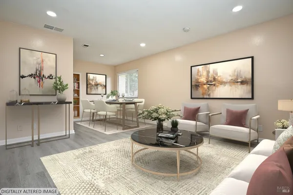 a living room with furniture and a rug