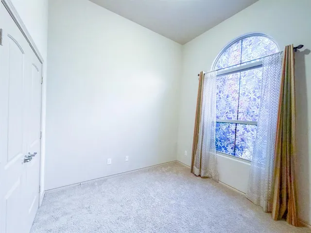 an empty room with windows mirror