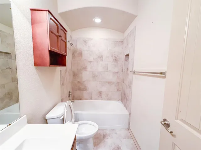 an empty room with a rug