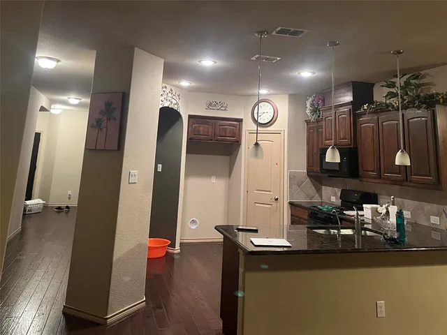 a view of a living room and bathroom